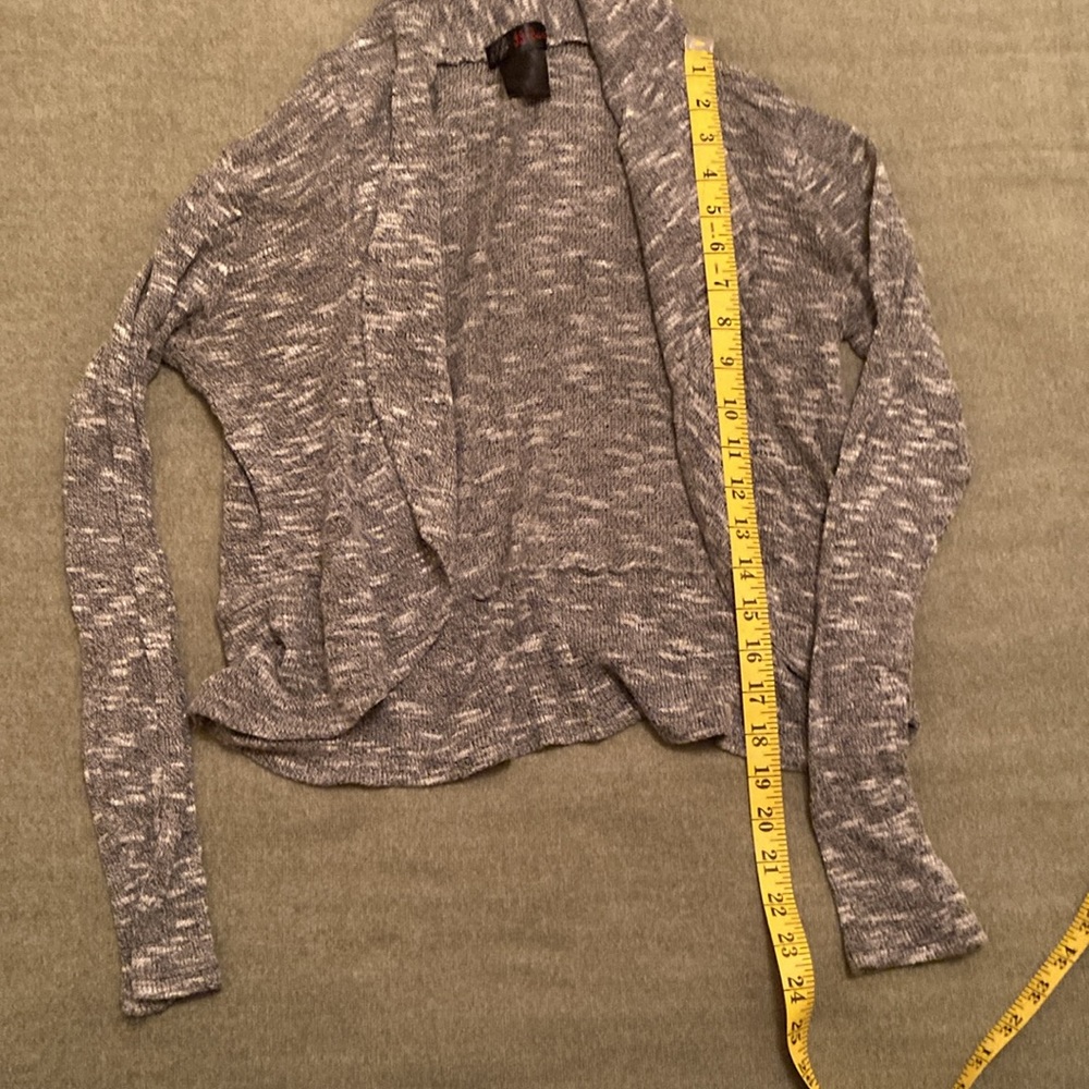 Grey small knit top jacket without buttons in excellent condition. Worn w/ TLC.